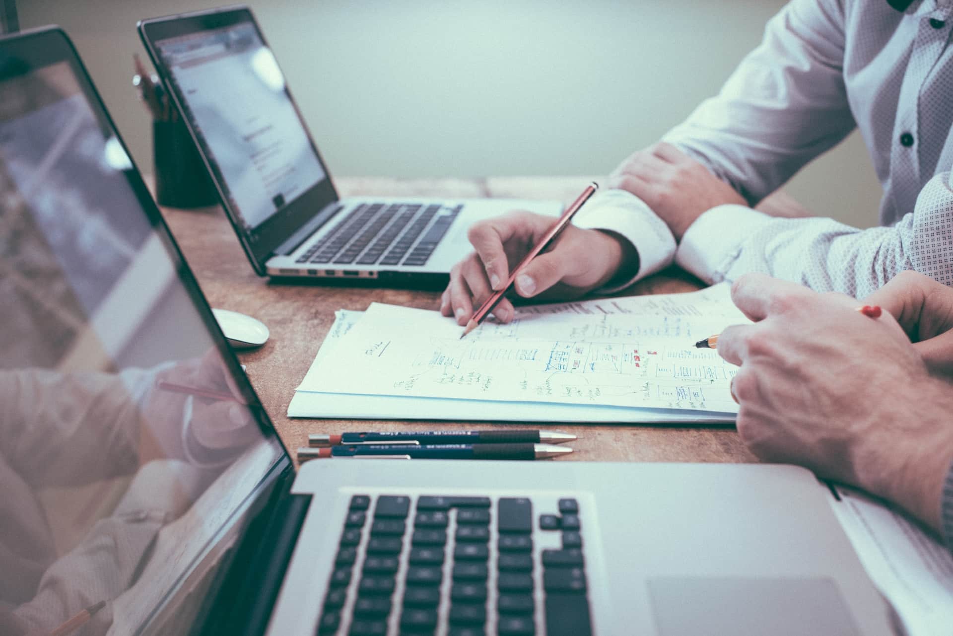 business owners calculating how much tax does a limited company pay