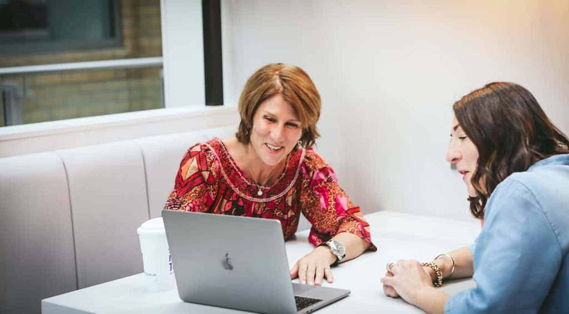 a business owner sat with an accountant benefiting from using a local accountant